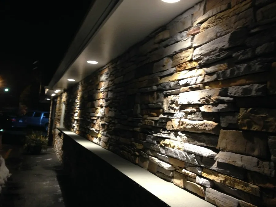 Ella's stone facade exterior at night